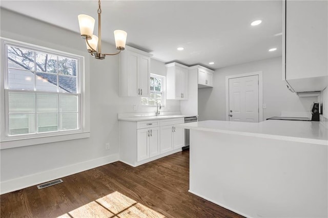 1271 Lorenzo Dr SW, Atlanta, GA 30310 - kitchen with range, plenty of natural light, white cabinetry, light countertops, and recessed lighting