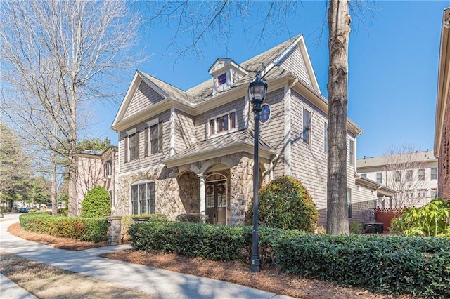 view of front of house with stone siding