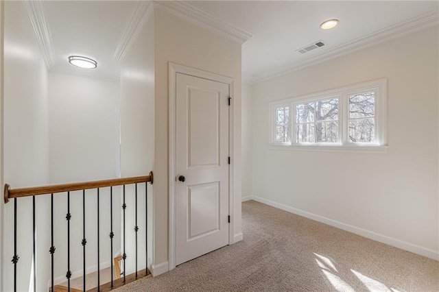 corridor featuring light carpet and crown molding