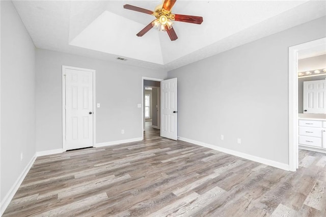 630 River Mill Rd, Bethlehem, GA 30620 - unfurnished bedroom featuring a raised ceiling, light wood-type flooring, baseboards, and ensuite bath