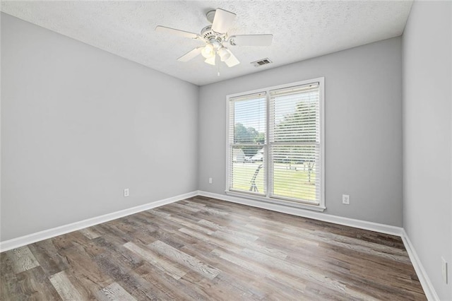 630 River Mill Rd, Bethlehem, GA 30620 - unfurnished room with wood finished floors, a ceiling fan, baseboards, and a textured ceiling