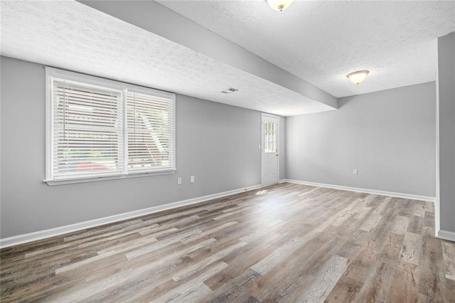 630 River Mill Rd, Bethlehem, GA 30620 - spare room with a textured ceiling, wood finished floors, and baseboards