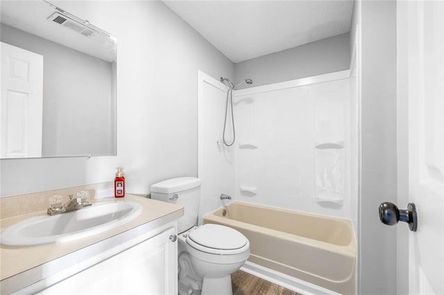 630 River Mill Rd, Bethlehem, GA 30620 - bathroom featuring bathtub / shower combination, vanity, toilet, and wood finished floors