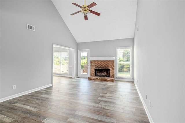 630 River Mill Rd, Bethlehem, GA 30620 - unfurnished living room with high vaulted ceiling, ceiling fan, baseboards, and wood finished floors