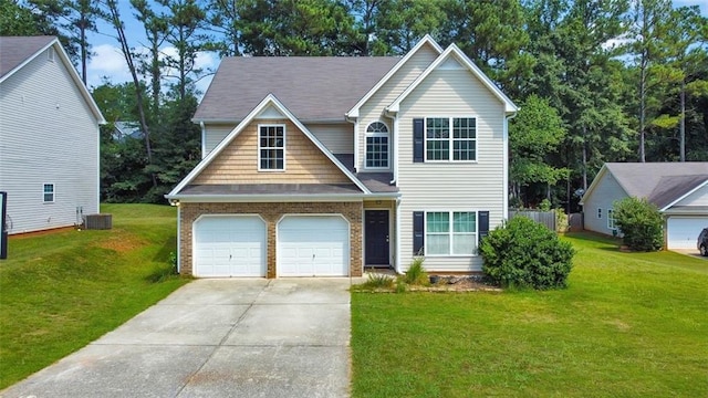 388 Oakhaven Way, Villa Rica, GA 30180 - view of front of home featuring central AC unit, a front yard, a garage, and concrete driveway