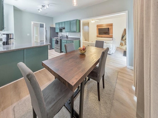 388 Oakhaven Way, Villa Rica, GA 30180 - dining area featuring baseboards, light wood-style floors, and a ceiling fan