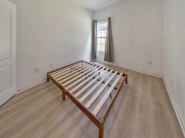 388 Oakhaven Way, Villa Rica, GA 30180 - unfurnished bedroom featuring baseboards and light wood finished floors