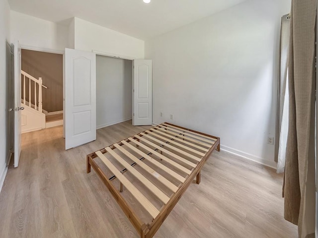 388 Oakhaven Way, Villa Rica, GA 30180 - unfurnished bedroom featuring light wood finished floors and baseboards