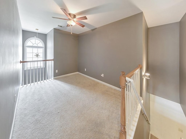 388 Oakhaven Way, Villa Rica, GA 30180 - unfurnished room featuring baseboards, visible vents, a ceiling fan, and light colored carpet