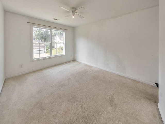 388 Oakhaven Way, Villa Rica, GA 30180 - spare room with baseboards, ceiling fan, visible vents, and carpet