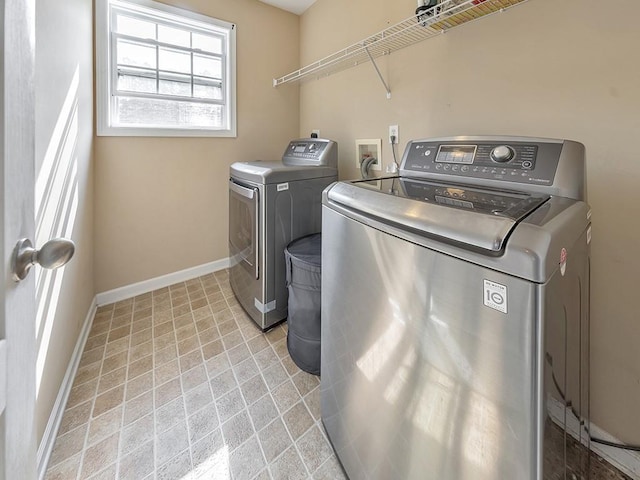 388 Oakhaven Way, Villa Rica, GA 30180 - laundry area featuring baseboards, washing machine and dryer, and laundry area