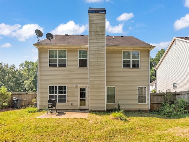 388 Oakhaven Way, Villa Rica, GA 30180 - rear view of property with a patio, a chimney, fence, and a lawn