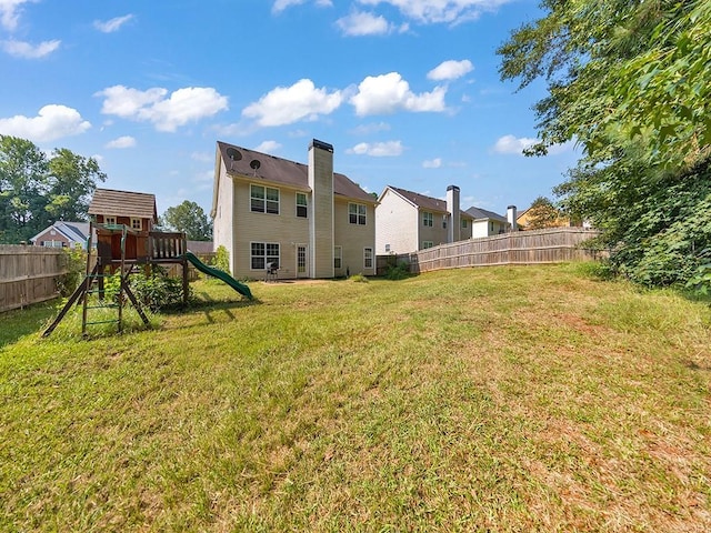 388 Oakhaven Way, Villa Rica, GA 30180 - view of yard with a fenced backyard and a playground
