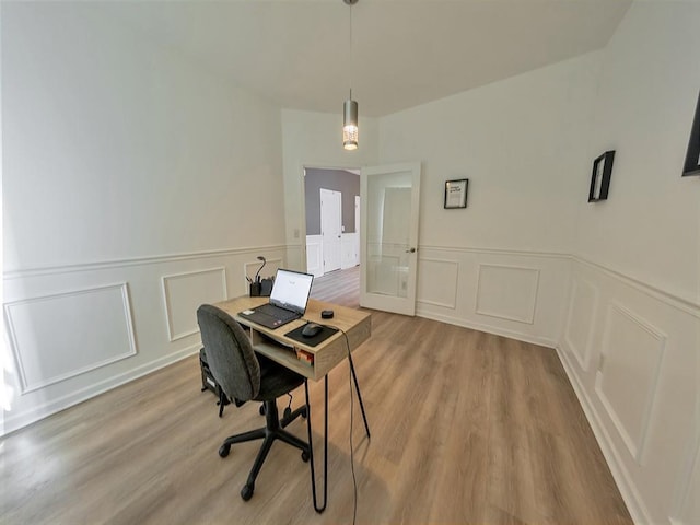 388 Oakhaven Way, Villa Rica, GA 30180 - office area with a decorative wall, wood finished floors, and french doors