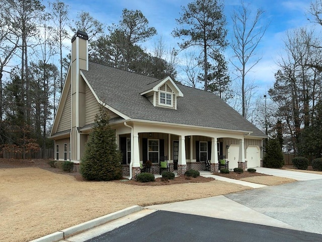 view of front of home with a garage and covered porch