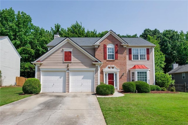 2113 Soque River Dr, Duluth, GA 30097 - colonial-style house with driveway, a garage, brick siding, and a chimney