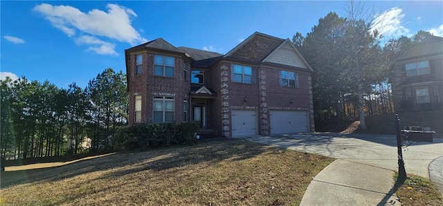 front facade featuring a garage and a front yard