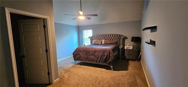 bedroom with vaulted ceiling, carpet floors, and ceiling fan