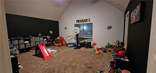 recreation room featuring high vaulted ceiling and carpet flooring