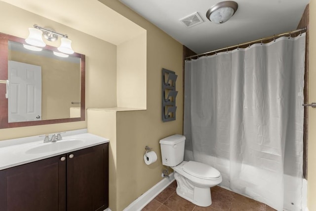 bathroom featuring visible vents, toilet, vanity, baseboards, and tile patterned floors