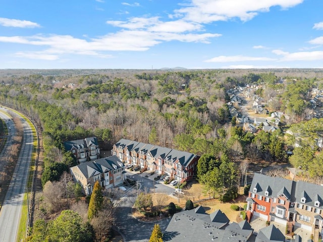 drone / aerial view with a residential view and a forest view