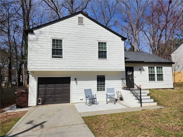 view of front of house with a garage, a shingled roof, and concrete driveway