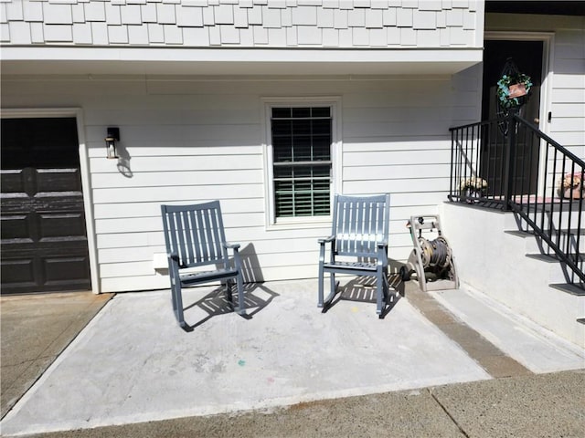 view of patio / terrace featuring a garage