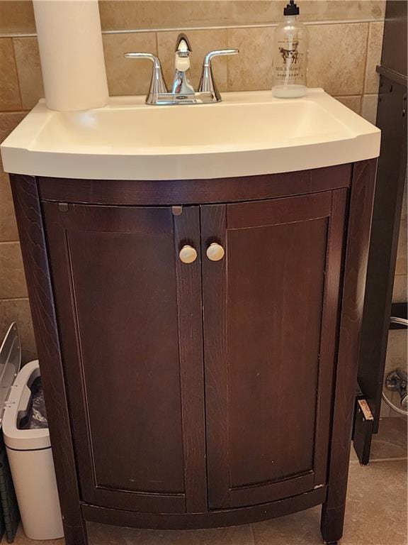 bathroom with tile walls and vanity