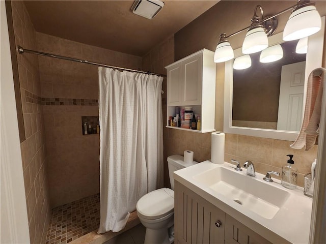 full bath with tasteful backsplash, a tile shower, tile walls, and toilet