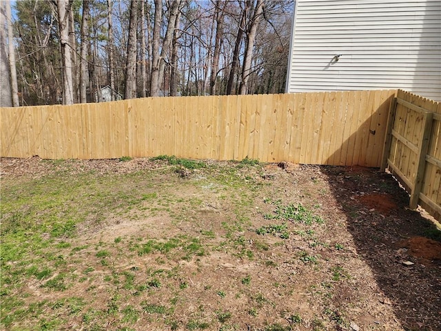 view of yard with a fenced backyard