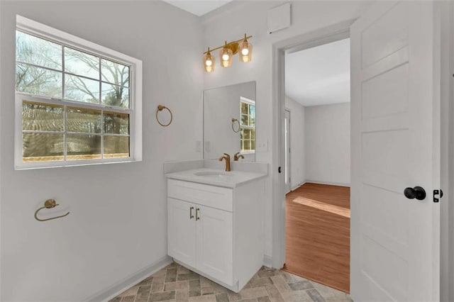 bathroom with vanity and baseboards