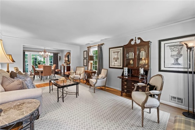 3287 Alton Rd, Atlanta, GA 30341 - living room featuring a chandelier, wood finished floors, ornamental molding, and baseboards
