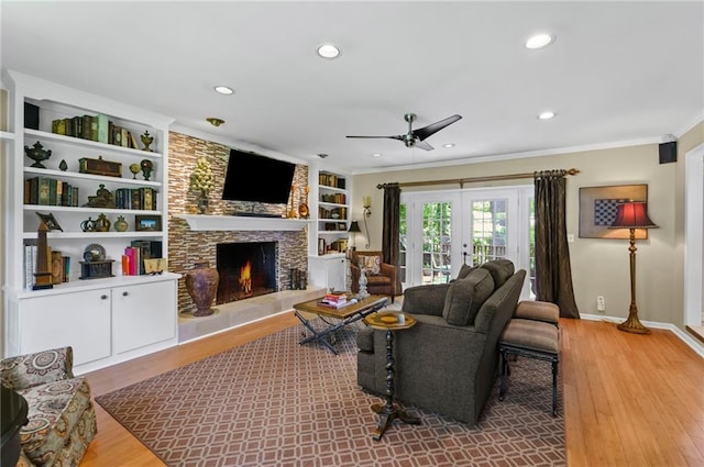 3287 Alton Rd, Atlanta, GA 30341 - living area featuring a ceiling fan, a stone fireplace, wood finished floors, ornamental molding, and baseboards