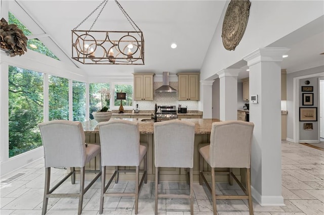 3287 Alton Rd, Atlanta, GA 30341 - kitchen with wall chimney exhaust hood, baseboards, range, a chandelier, and decorative backsplash