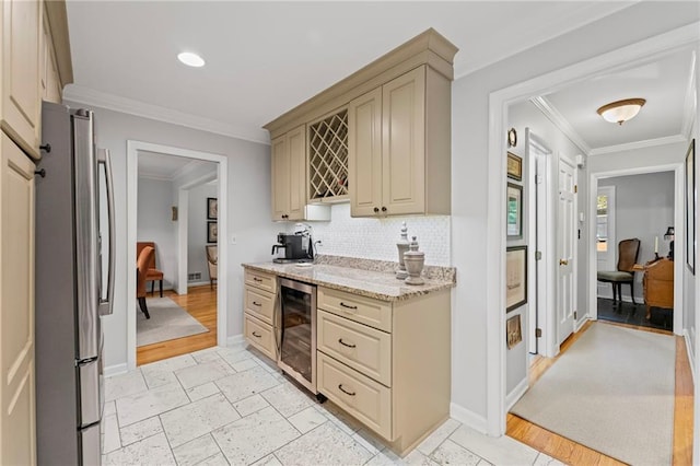 3287 Alton Rd, Atlanta, GA 30341 - kitchen with freestanding refrigerator, beverage cooler, cream cabinets, crown molding, and decorative backsplash