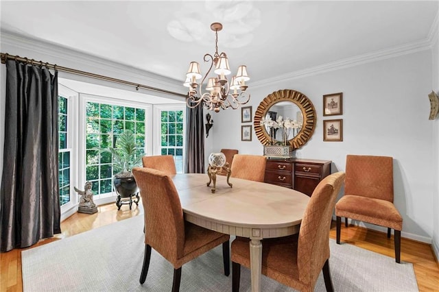 3287 Alton Rd, Atlanta, GA 30341 - dining room featuring a chandelier, ornamental molding, light wood-type flooring, and baseboards