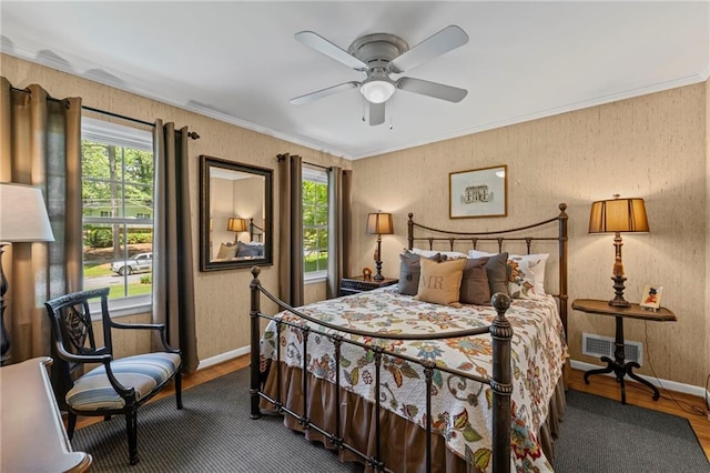3287 Alton Rd, Atlanta, GA 30341 - bedroom with wood finished floors, multiple windows, baseboards, and crown molding