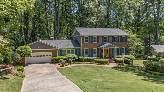 3287 Alton Rd, Atlanta, GA 30341 - colonial-style house featuring driveway, a garage, a front lawn, and brick siding