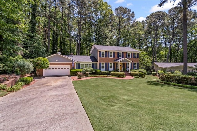3287 Alton Rd, Atlanta, GA 30341 - colonial inspired home featuring an attached garage, concrete driveway, a front lawn, brick siding, and a chimney
