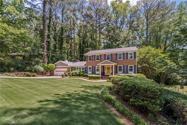 3287 Alton Rd, Atlanta, GA 30341 - colonial house featuring a garage, a front lawn, concrete driveway, and brick siding