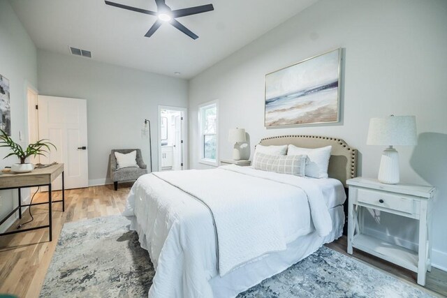 bedroom with ceiling fan and light hardwood / wood-style flooring