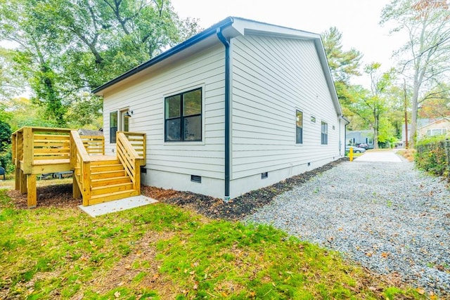 view of side of property featuring a deck