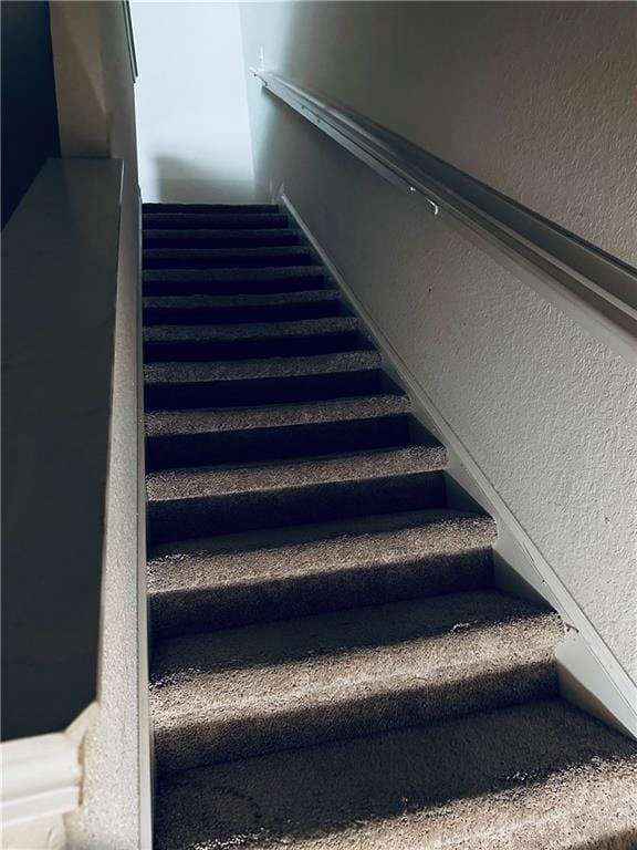 stairs with a textured wall