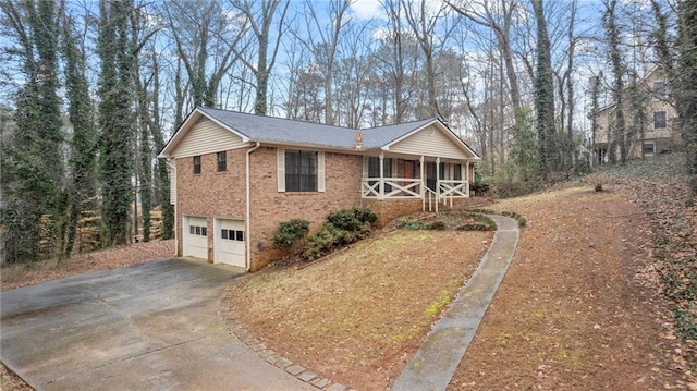 view of home's exterior with a garage and covered porch