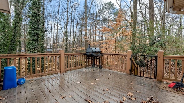 wooden terrace featuring grilling area