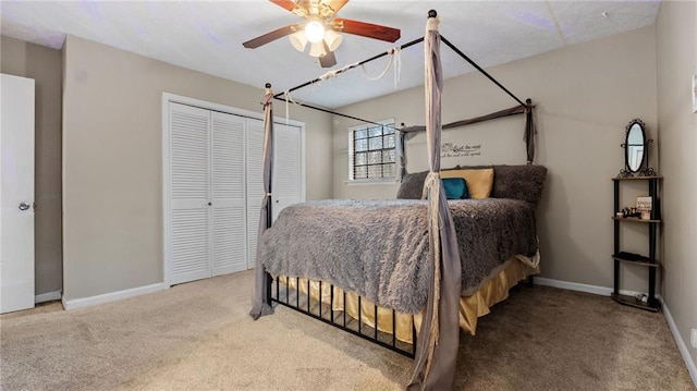 bedroom with ceiling fan, carpet flooring, and a closet