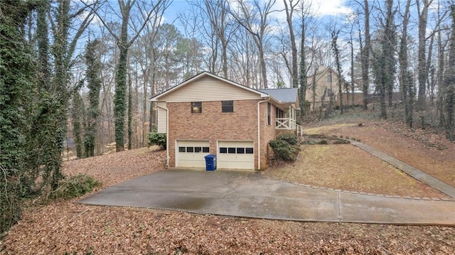 view of side of home featuring a garage