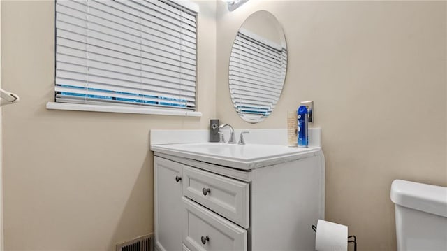 bathroom with vanity and toilet