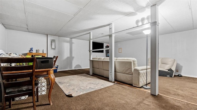 office space with a drop ceiling and dark carpet