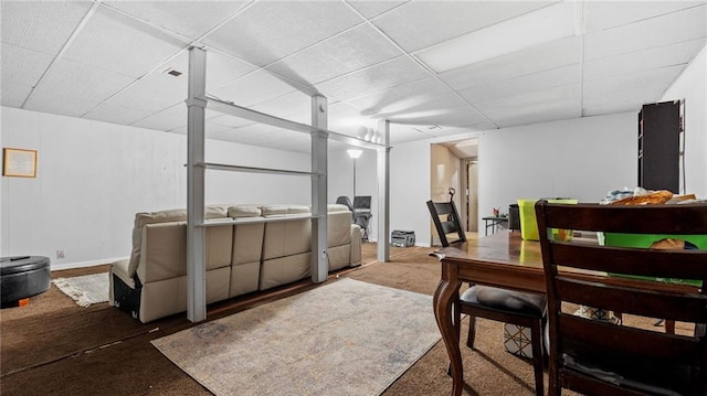 dining area featuring a paneled ceiling